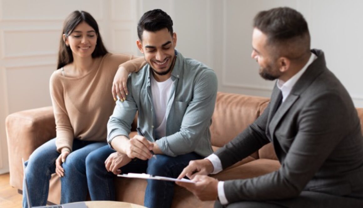 Real Estate Agent Showing Buyers Contract, Man Signing