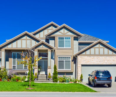 Brand new residential house with car parked on driveway in front
